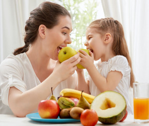 37039405 - happy family eating fresh fruit