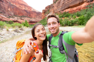 31242802 - travel hiking selfie self-portrait photo by happy couple on hike.